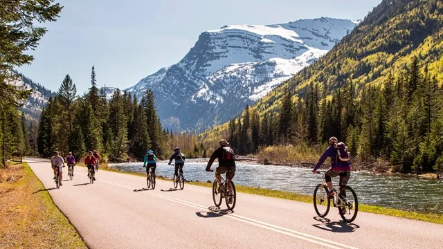 A group of bicycle riders passing through, Glacier National Park