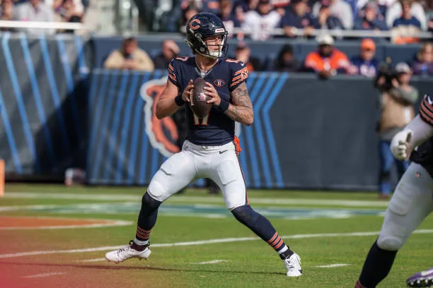 Quarterback Tyson Bagent #17 of the Chicago Bears looks to make a pass during the second half of an NFL football game against the Minnesota Vikings at Soldier Field on October 15, 2023 in Chicago, Illinois. (Photo by Todd Rosenberg/Getty Images)