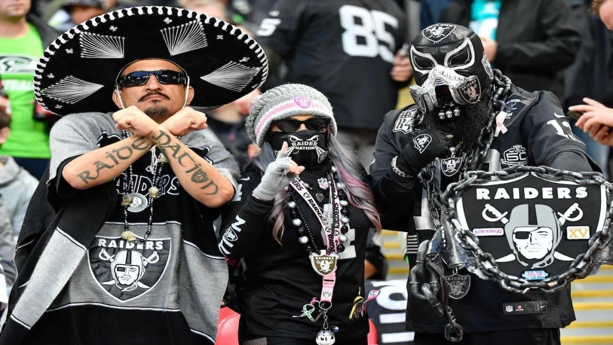 In a yesterday match, fans of raiders posing for a photograph.